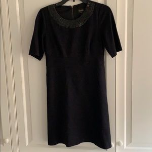 Black dress with embellishments around color